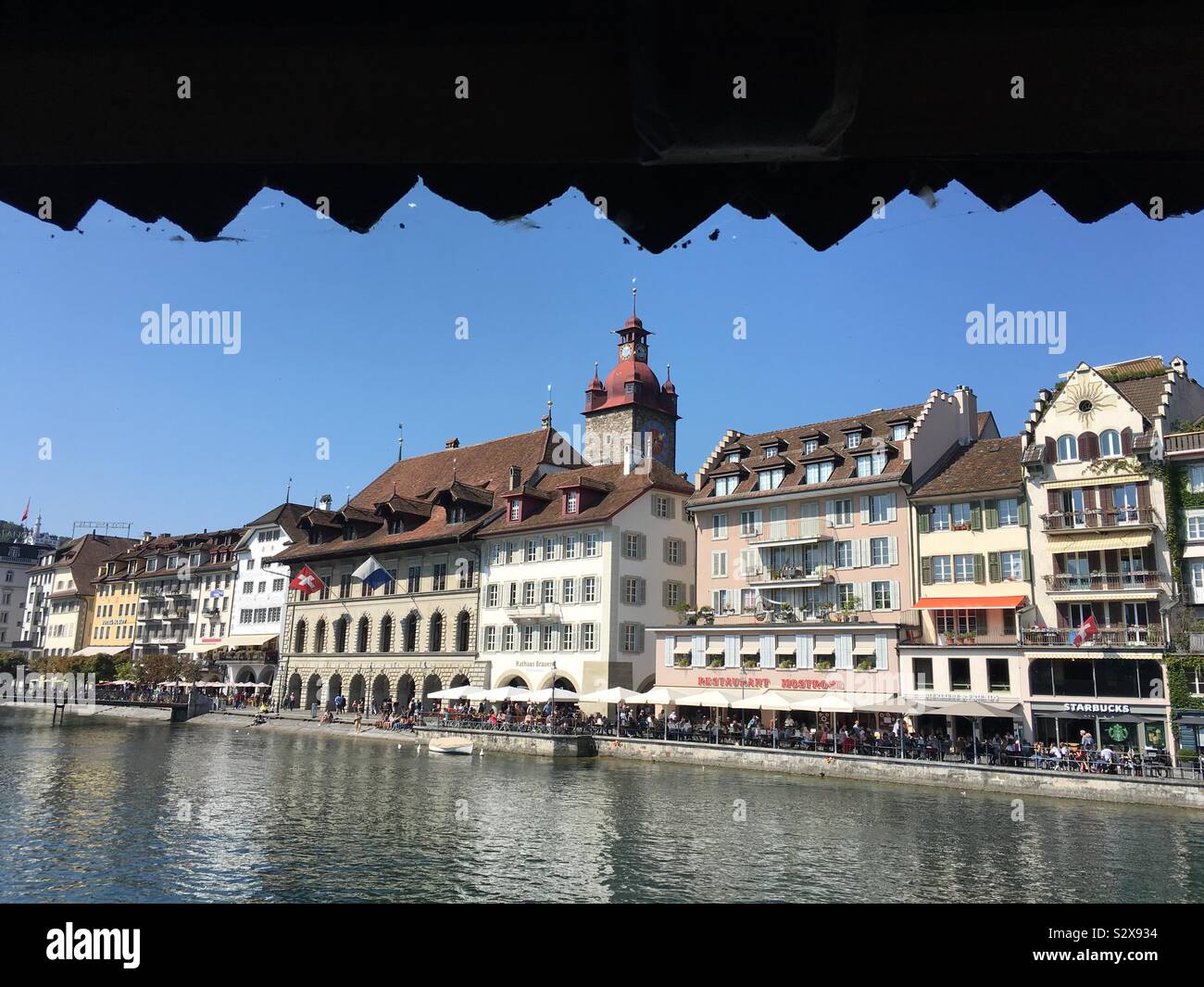 Waterfront of medieval town Lucerne along Reuss River seen from the Chapelbridge. Switzerland. Stock Photo