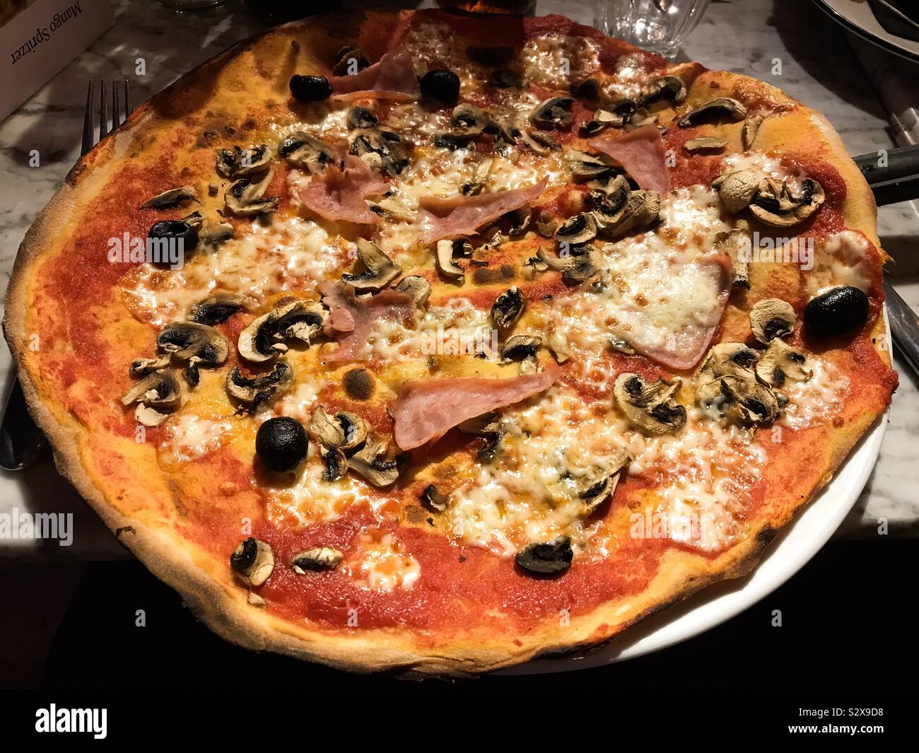 A pizza in a restaurant. - Smartphone Captured Stock Image