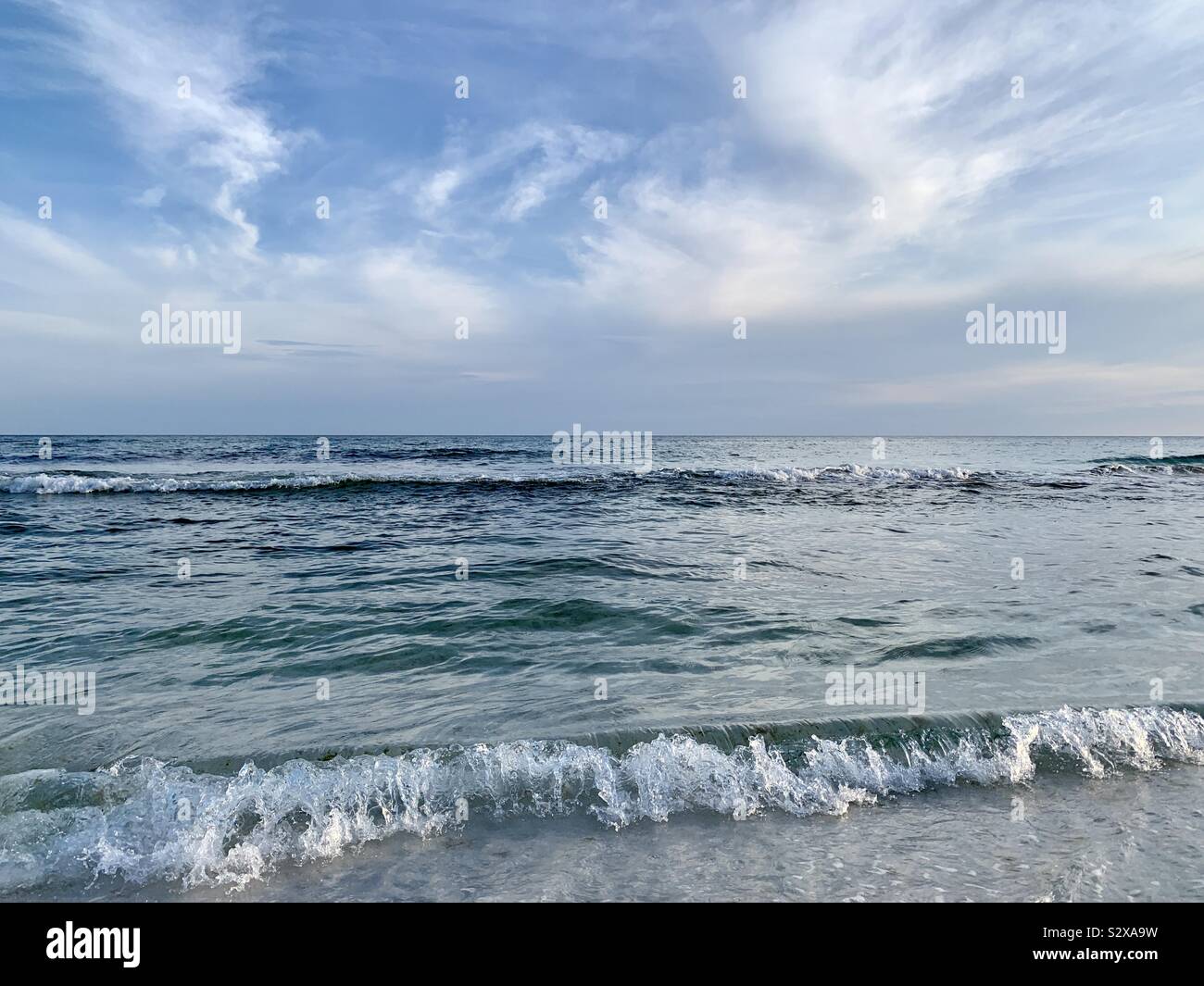 Seascape with view of beautiful ocean waves and blue skies with white clouds - Smartphone Captured Stock Image