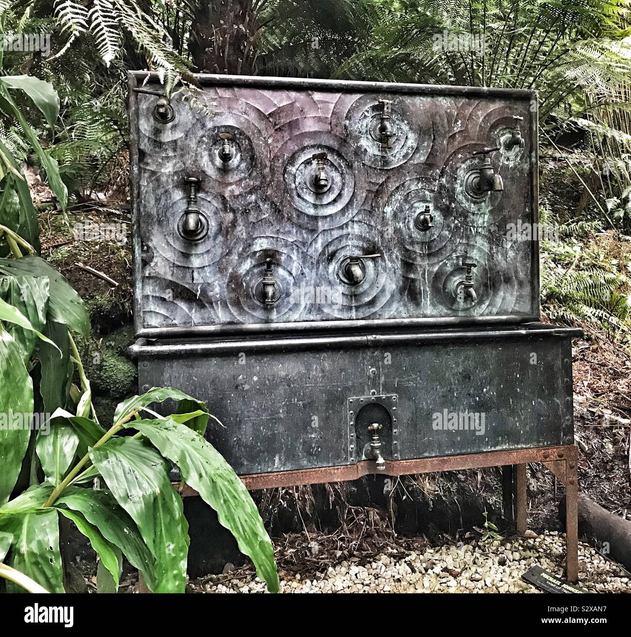 Sculpture by Michael Johnson Entitled Wall Of Taps At Tremenheere Sculpture Gardens - Cornwall UK - Smartphone Captured Stock Image