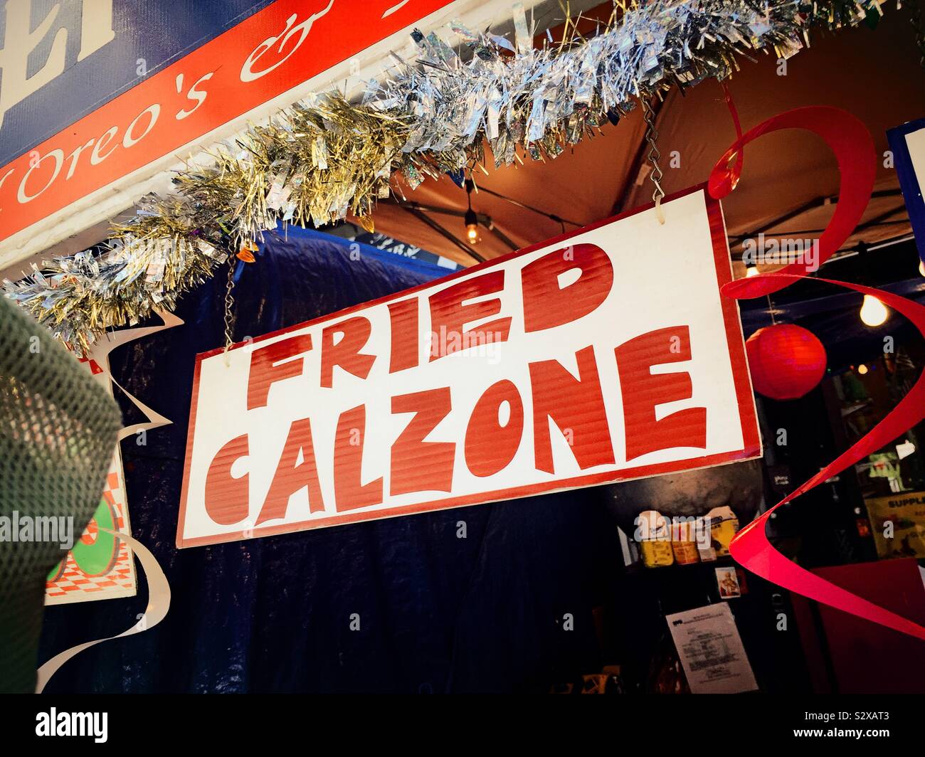 A food stall offering fried calzone on Mulberry Street during the feast of San Gennaro, Little Italy, NYC, USA - Smartphone Captured Stock Image