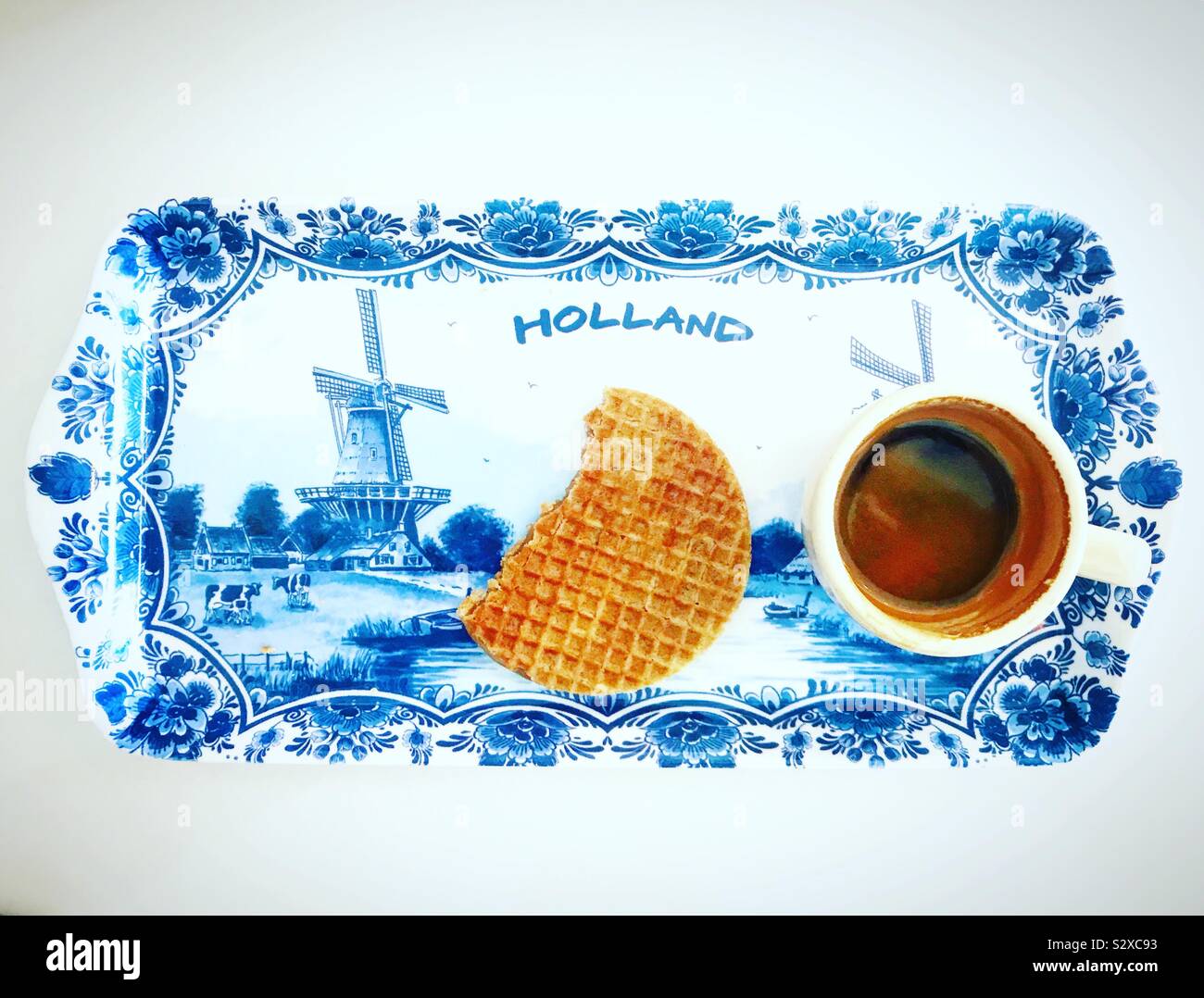 A cup of coffee and a waffle in a folk art tray in Holland Waffles restaurant in Mexico City, Mexico Stock Photo