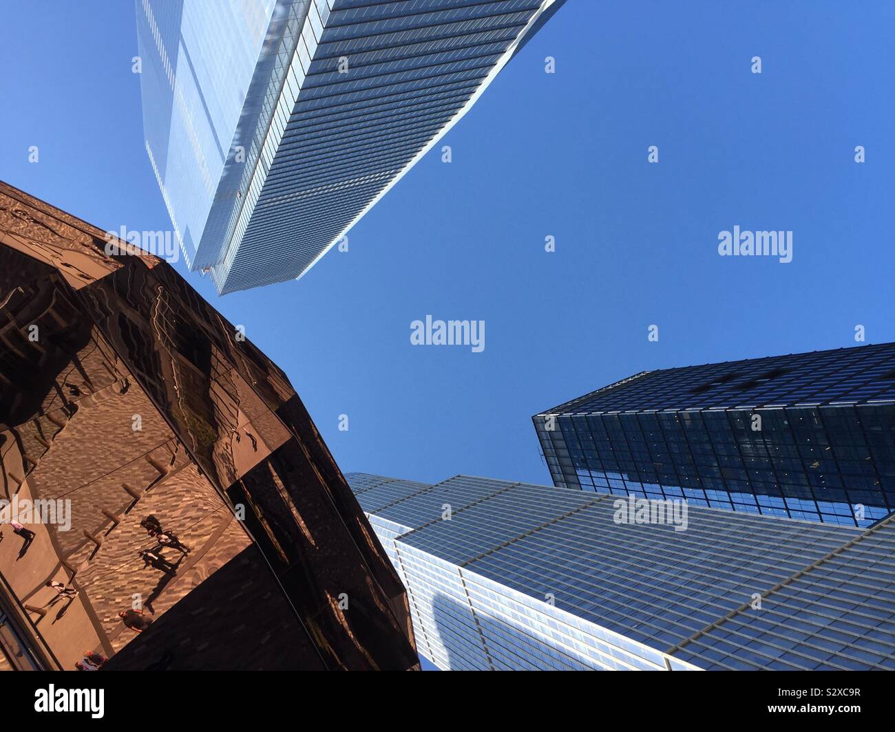 The vessel and skyscrapers are the latest attractions in Hudson yards, Manhattan, NYC, USA - Smartphone Captured Stock Image