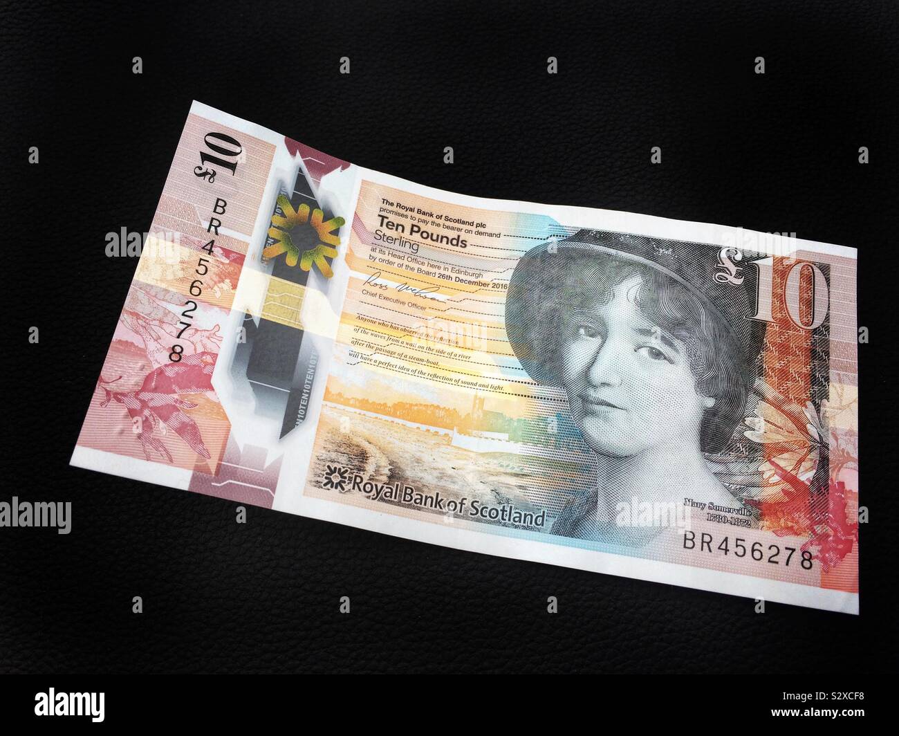 Scotish ten pound banknote on a black background featuring Mary Somerville Stock Photo