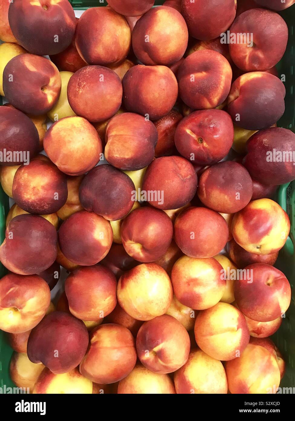 Fresh peaches in a street market - Smartphone Captured Stock Image