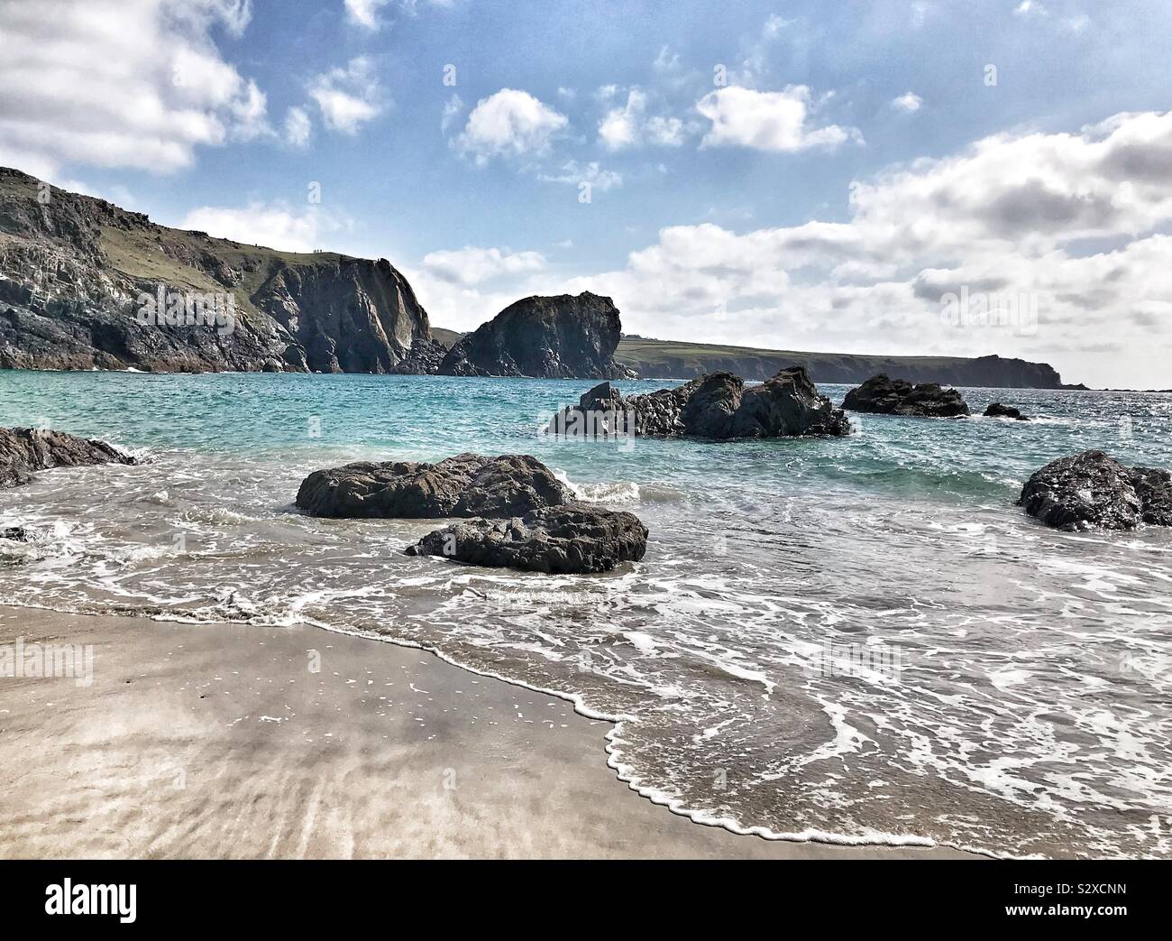 View From the Beach Out to the Atlantic Ocean showing Rocks and Cliffs in background- Kynance Cove, Cornwall UK - Smartphone Captured Stock Image