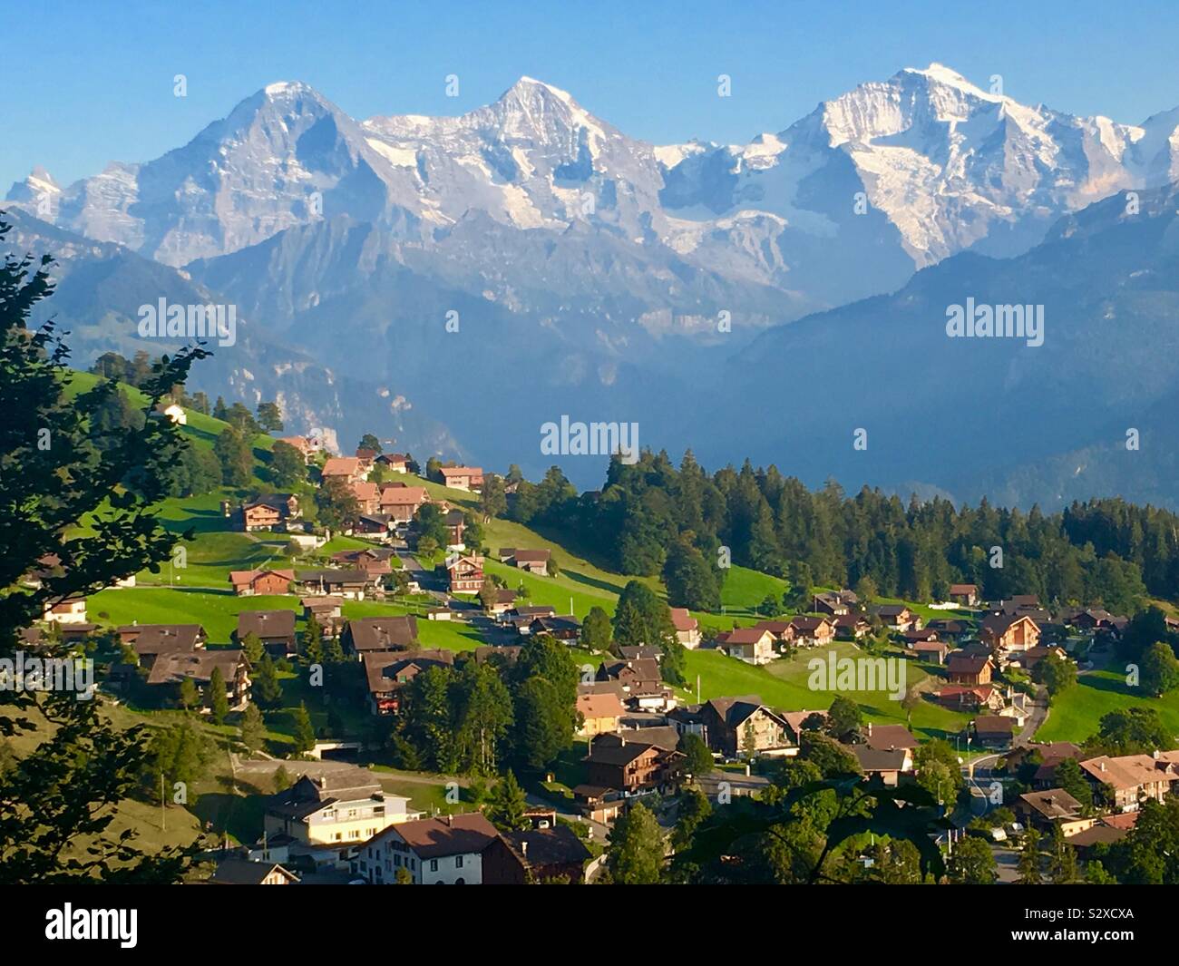 Town Beatenberg with Bernese alps, f.l. Mtns. Eiger, Mönch, Jungfrau, Switzerland. Stock Photo