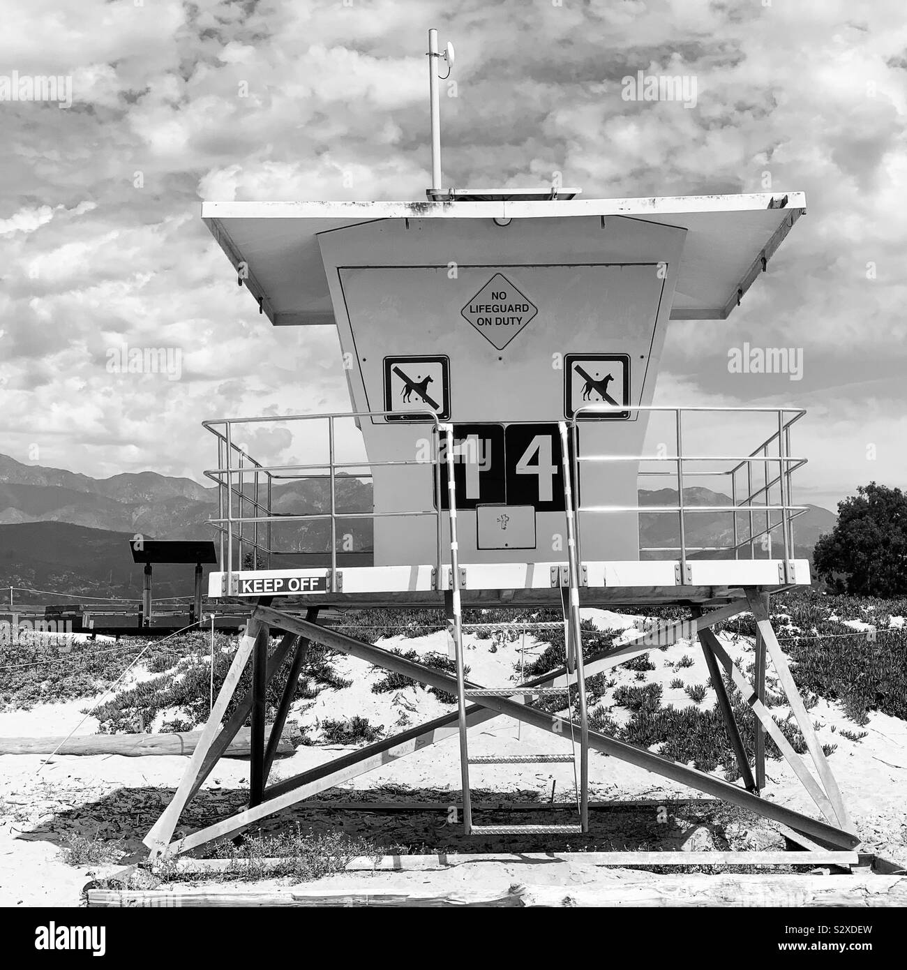 Black and white image of Lifeguard Station 14, Carpinteria State Beach, Carpinteria, California, United States Stock Photo