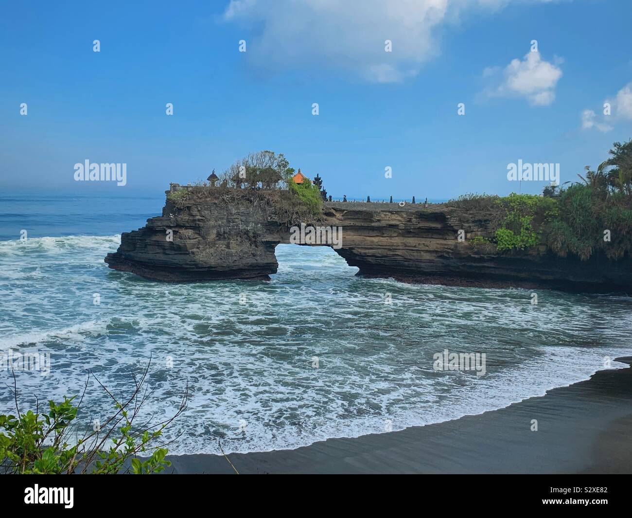 Hindu temple on rocky point in Bali, Indonesia - Smartphone Captured Stock Image