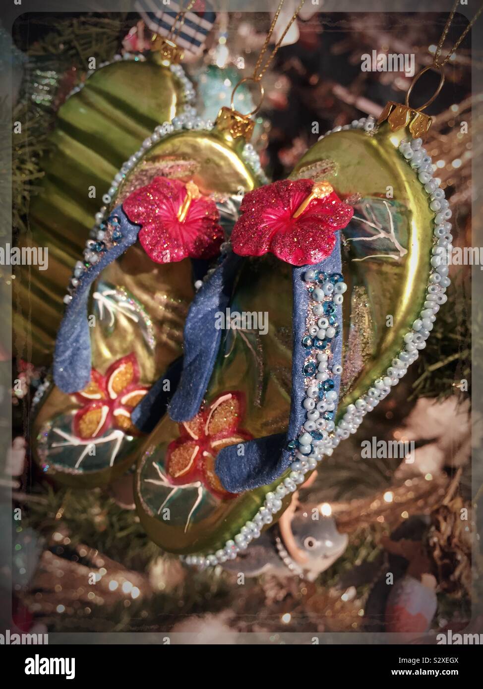 Christmas ornament in the shape of colorful beach flip-flops, USA - Smartphone Captured Stock Image