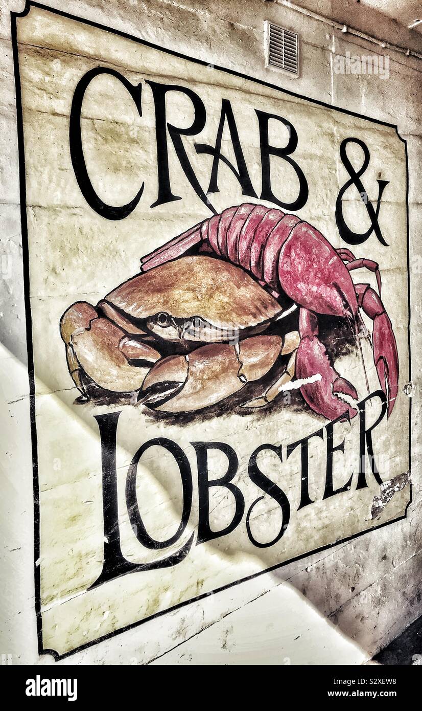 Crab and Lobster Wall Advertisement In An Alleyway At Port Isaac
