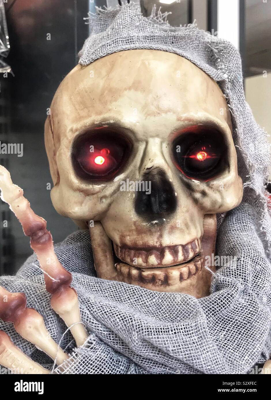 Skull with glowing, red eyes Stock Photo