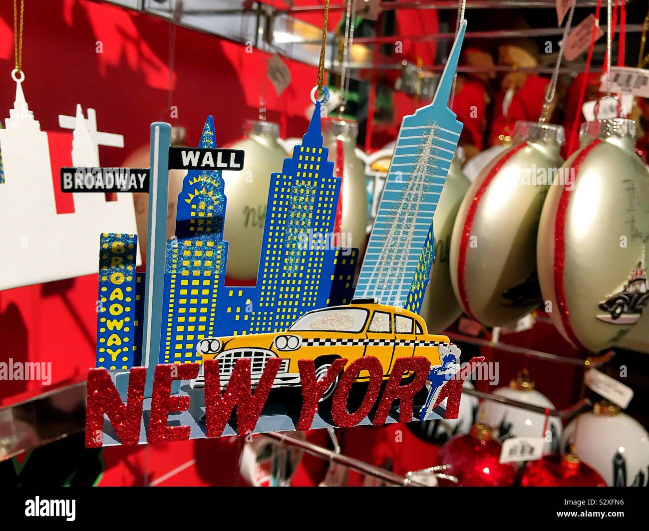 Christmas ornaments of iconic tourist attractions in New York City for sale at a department store during the holiday season, NYC, USA - Smartphone Captured Stock Image