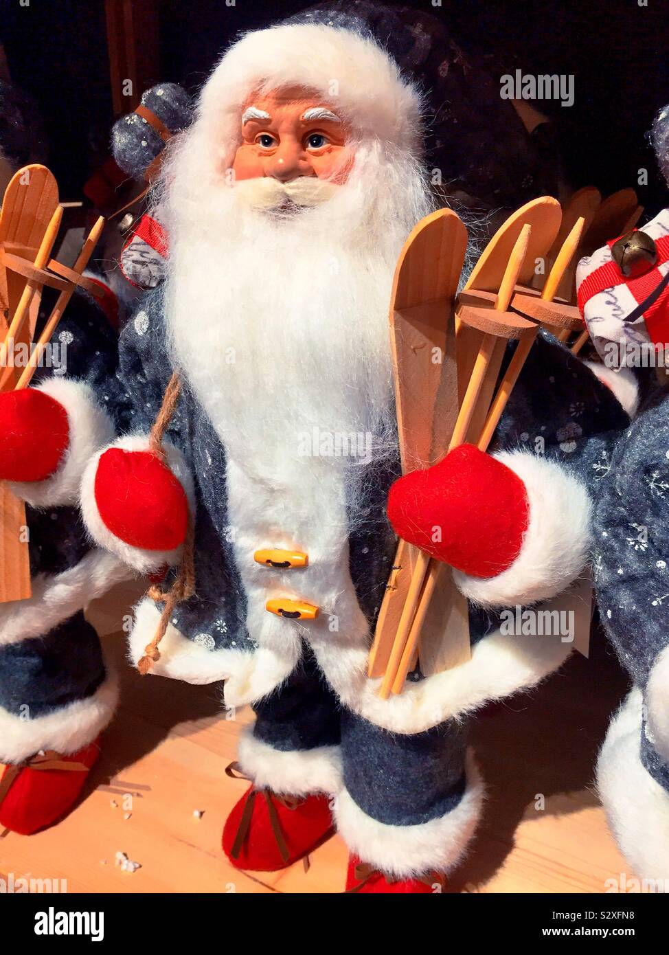 A Santa Claus figurine home decor piece for sale at a department store during the holiday season, USA - Smartphone Captured Stock Image