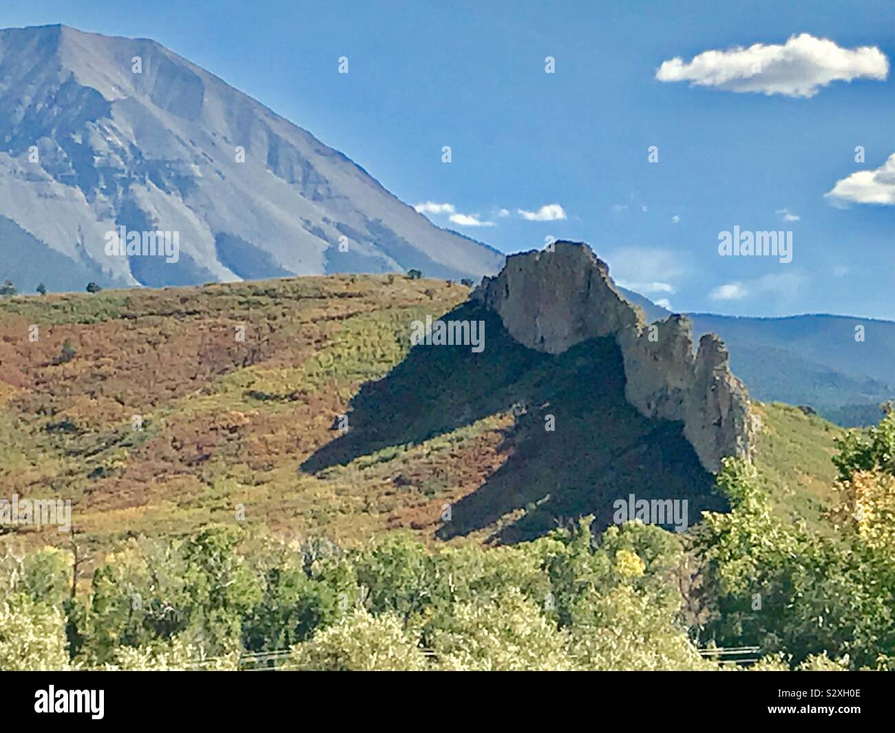 Dikes, or molten lava formations in the foreground, Spanish Peaks in