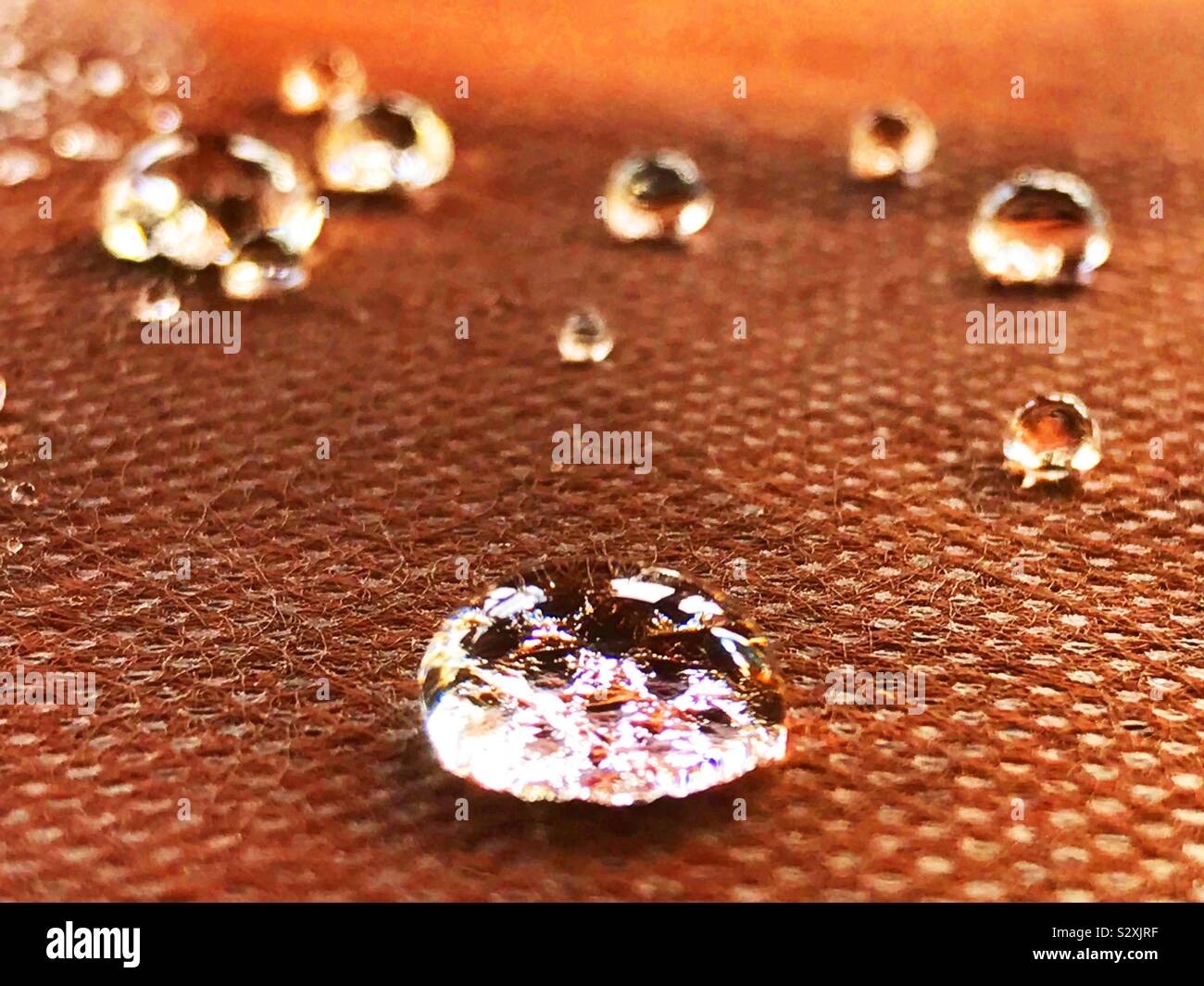 Drops of water on tablecloth. Close view. Stock Photo