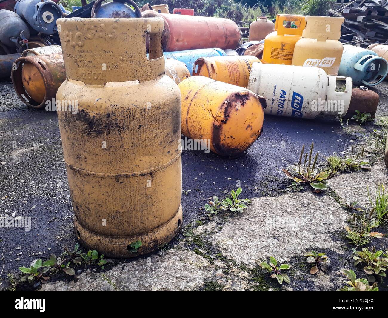 Old, rusty gas bottles on scrapyard Stock Photo Alamy