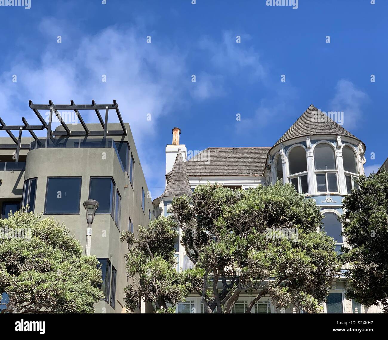 Homes of different architectural styles overlooking the beach, Manhattan Beach, California, United States - Smartphone Captured Stock Image