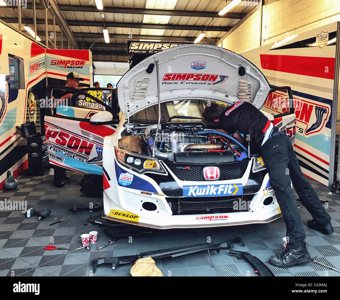 Pit Garage Of Matt Simpson With Mechanics Working On His Car At The BTCC At Silverstone UK 2019 - Smartphone Captured Stock Image