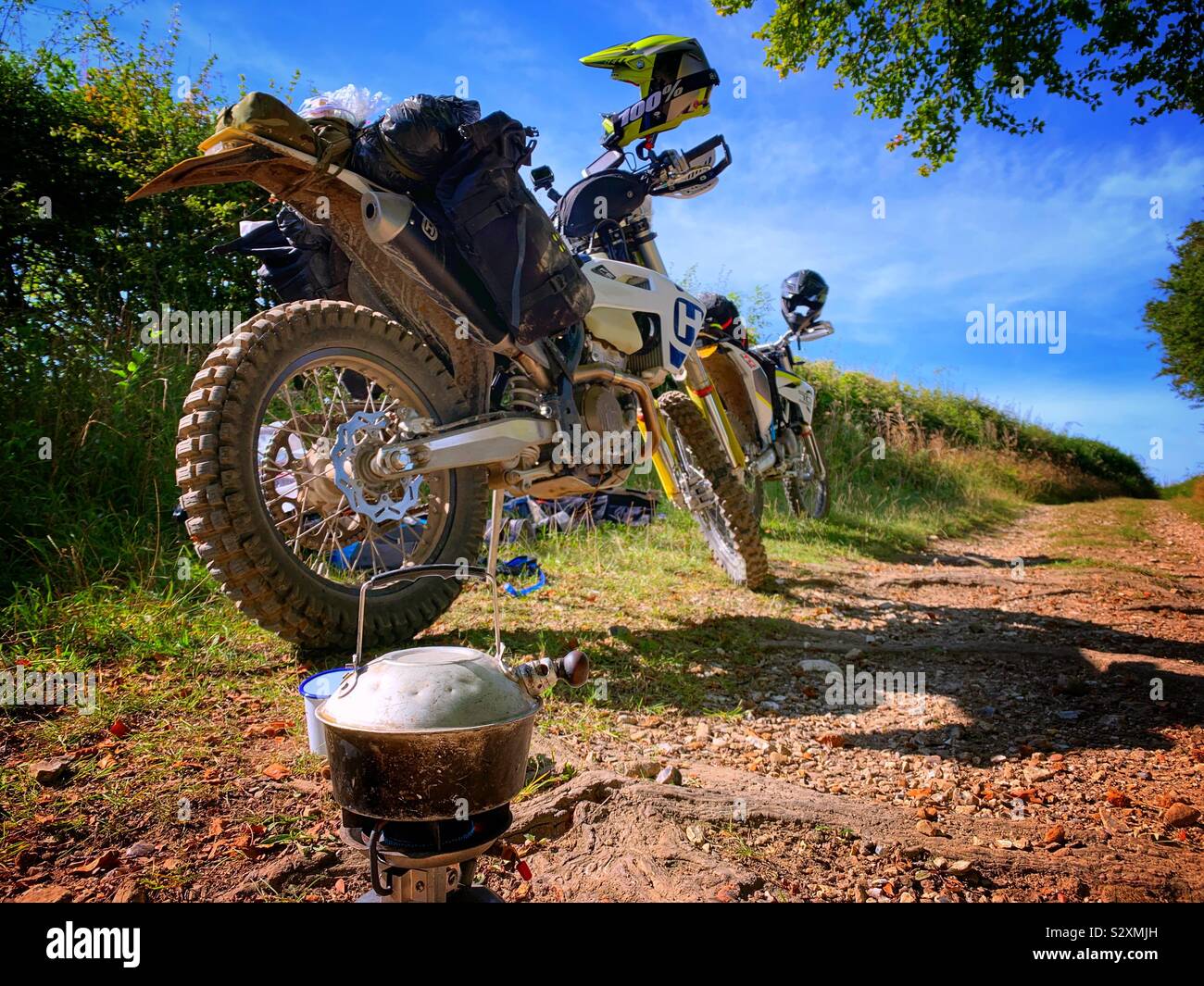 Off-road dry bikes stopping for coffees break Stock Photo