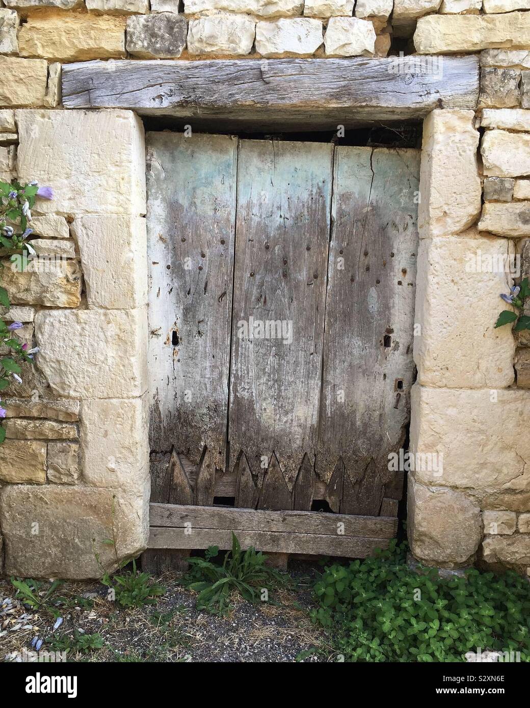 Ancient doorway from the Middle Ages in the unspoilt French commune of Verteuil-sur-Charente. Stock Photo