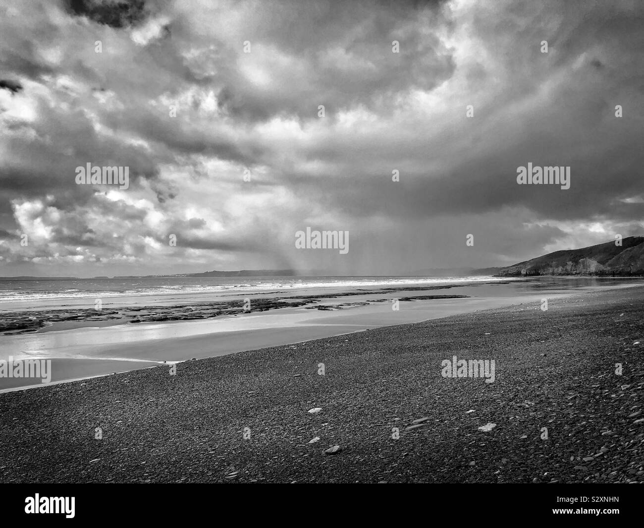 Approaching heavy rain on Marros beach, South West Wales, September. Stock Photo