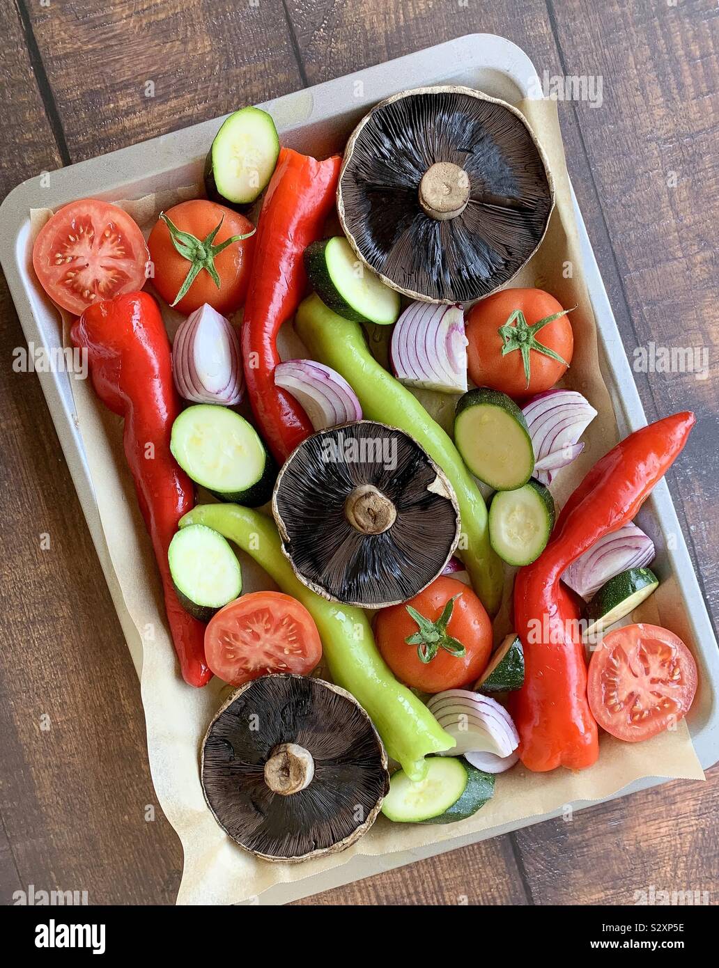 Raw vegetables on roasting tray Stock Photo Alamy