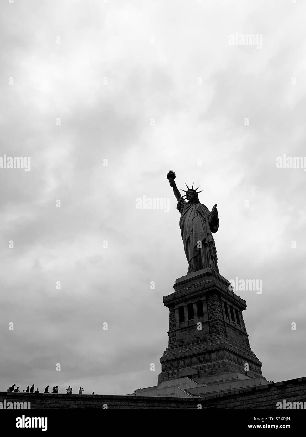 People looking and taking photos at the Statue of Liberty. Ny, New York, USA. Stock Photo