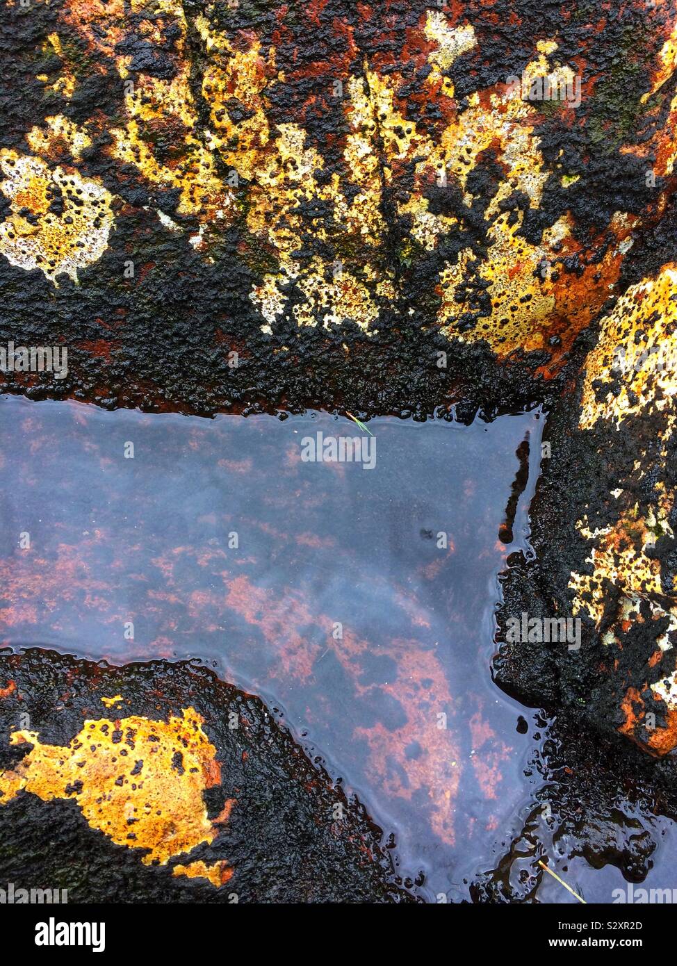 Water reflections on rocks. Elgol, isle of Skye, Scotland - Smartphone Captured Stock Image