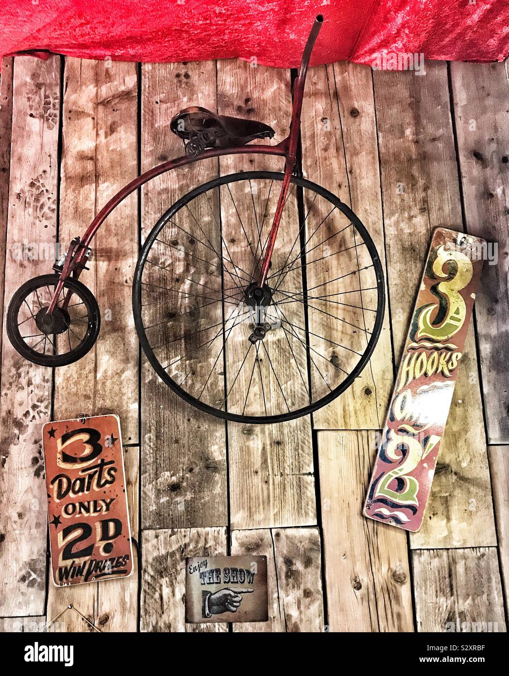 Vintage Tea Room Wall Display Of Penny Farthing Bicycle And Signs In Welshpool, Wales Stock Photo