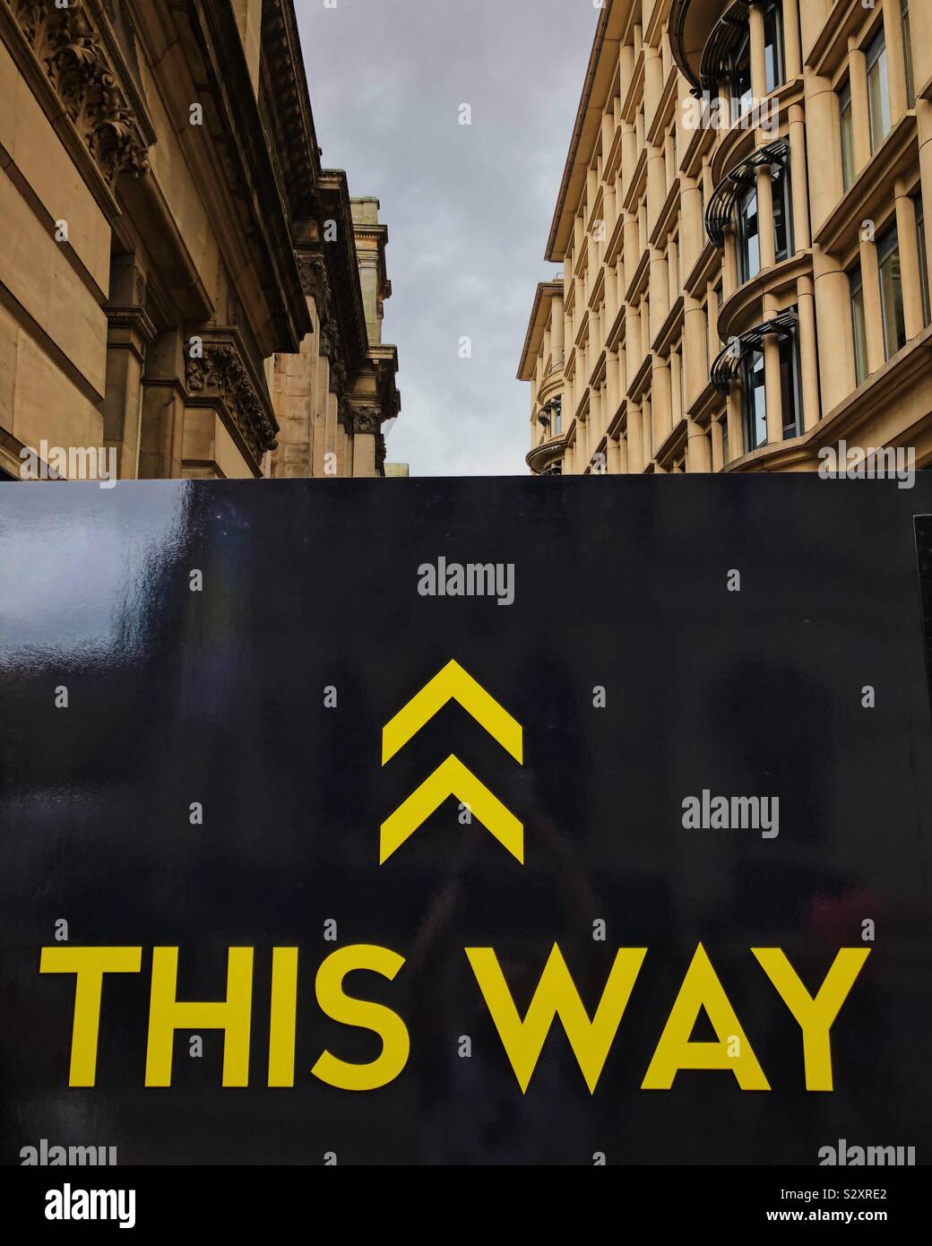 This way. Abstract diversion sign. - Smartphone Captured Stock Image