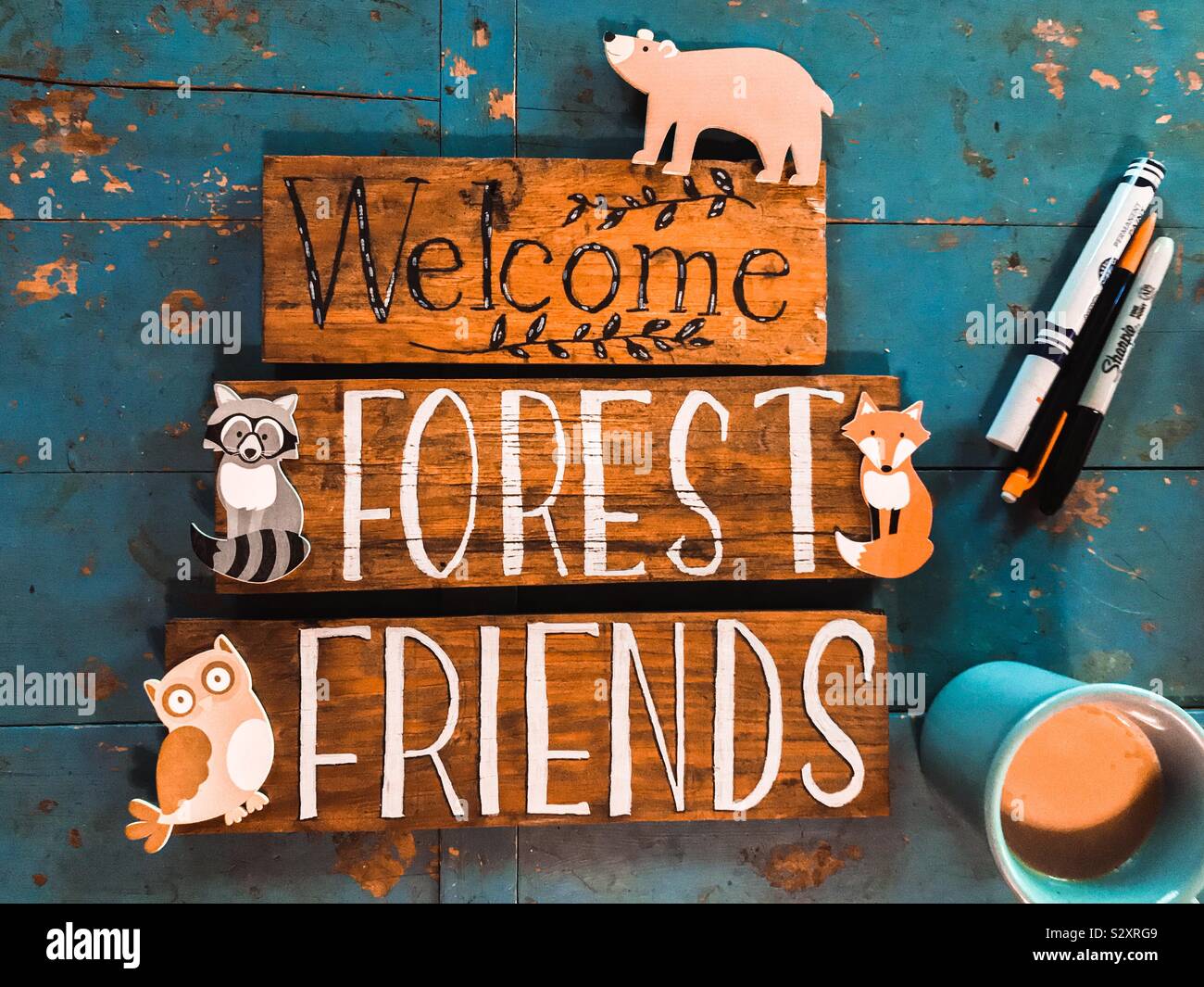 Just crafted wooden nursery decor signs reading “Welcome Forest Friends” - Smartphone Captured Stock Image