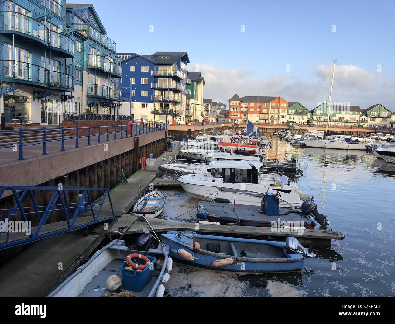 Early morning on a mid autumn UK day in Devon. The photo is from a prestigious harbour development, near Exmouth seafront. Stock Photo