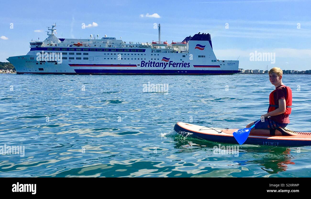 Paddleboarding in Poole harbour Stock Photo Alamy
