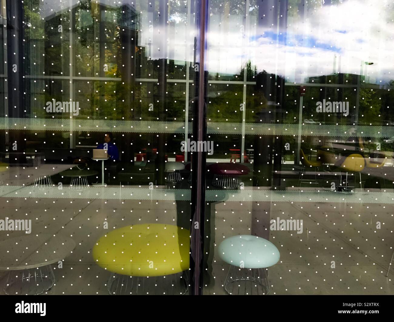 Dotted screen on a modern building to prevent bird collisions, Ontario, Canada - Smartphone Captured Stock Image