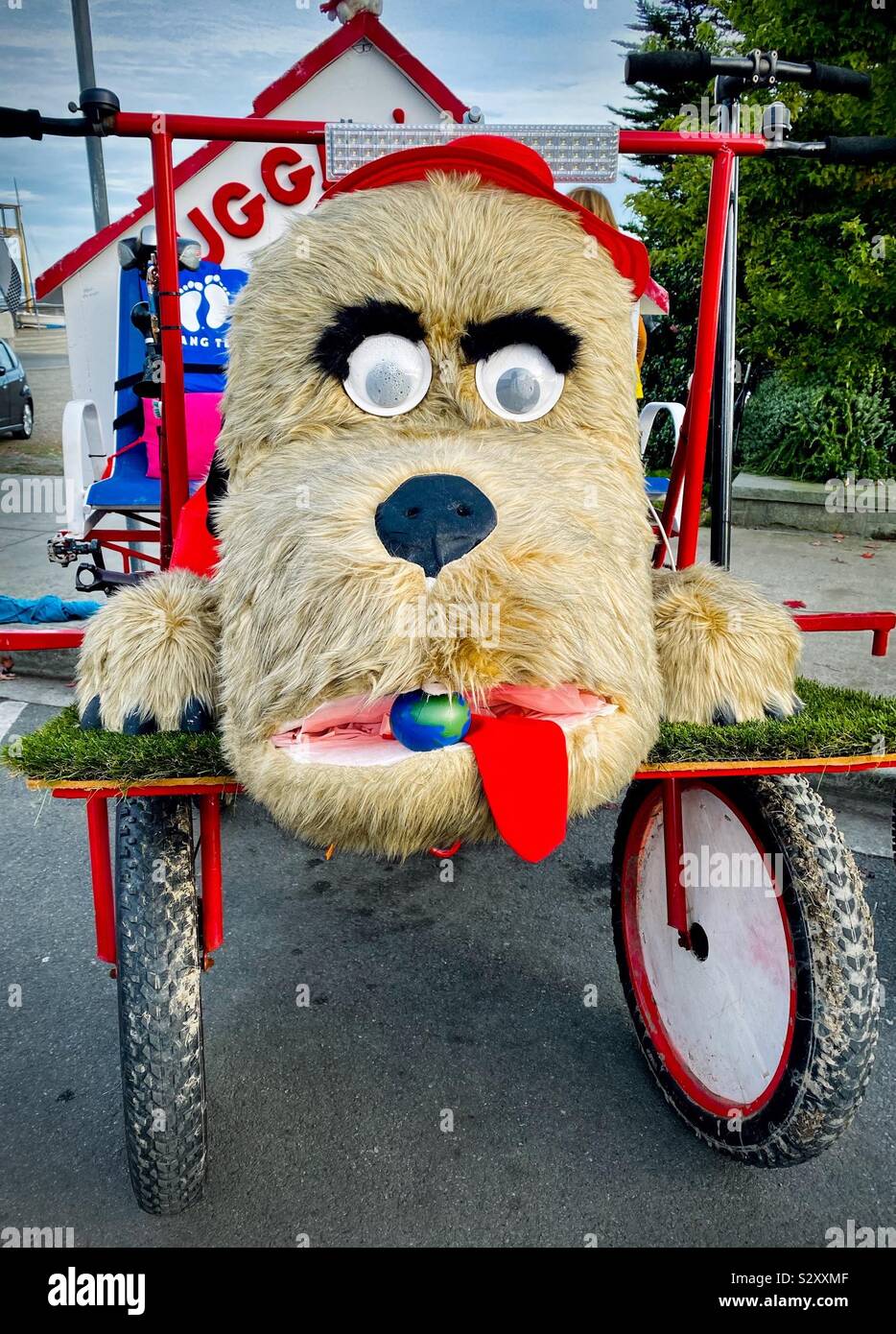 Entrant “Huggin Dogs” in the Kinetic Sculpture Race in Poet Townsend Wa, USA 2019. The amphibious sculptures are human powered and need to navigate road, water, sand and mud - Smartphone Captured Stock Image