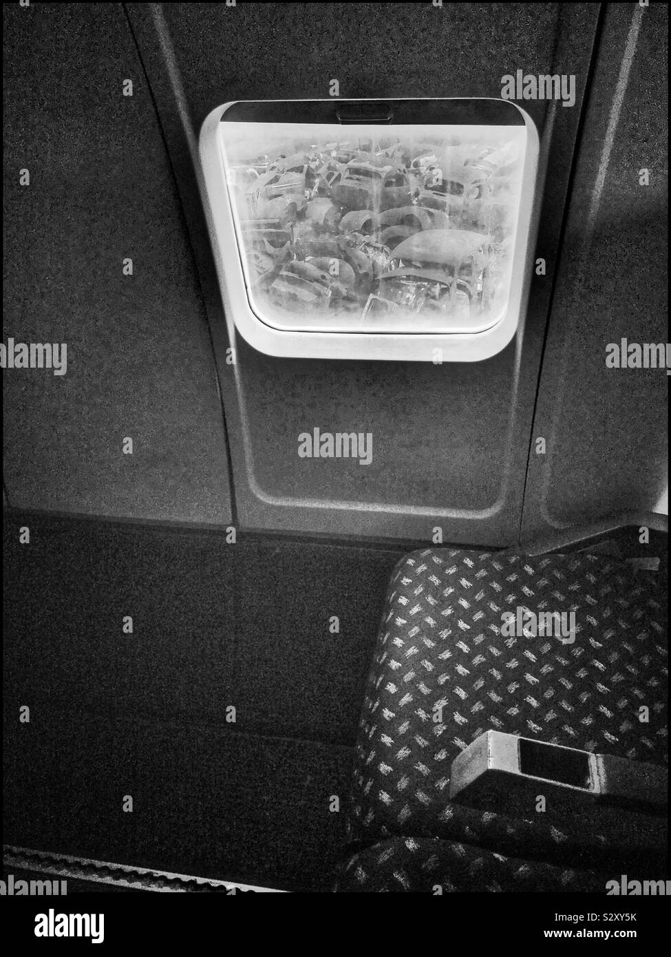 Looking out at old vehicles from Old Convair aeroplane at the Wijnland Auto Museum , Joostenberg Vlakte, Cape Town, South Africa. - Smartphone Captured Stock Image