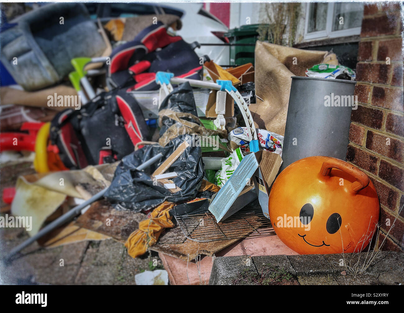 Space hopper amongst the contents of a cleared house, Long Lane, East Finchley, London. - Smartphone Captured Stock Image