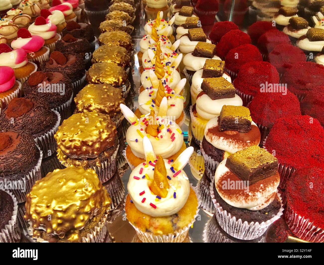 Unicorn cupcakes for sale at Harrods Foodhall - Smartphone Captured Stock Image