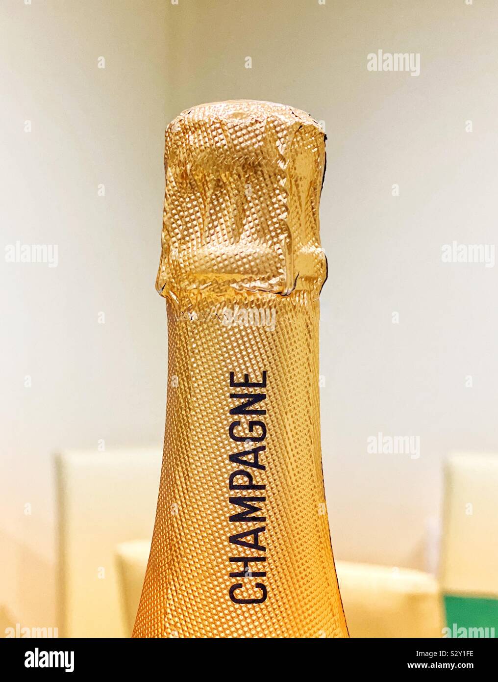 Foil covered top of a champagne bottle - Smartphone Captured Stock Image