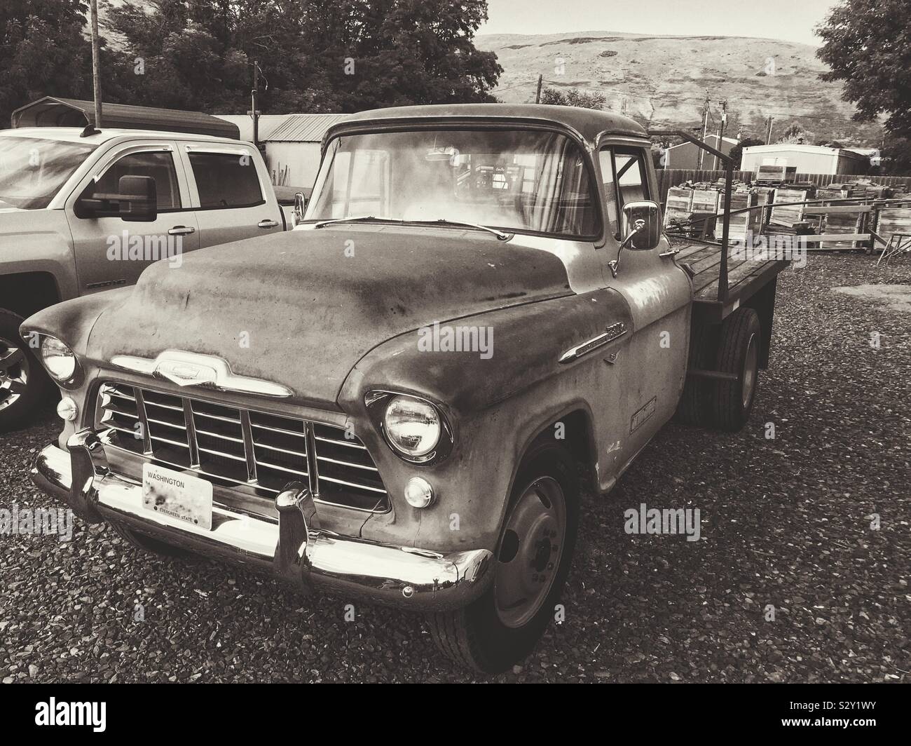 Vintage black and white photo of vintage fifties Chevy work truck 3/4 view Stock Photo