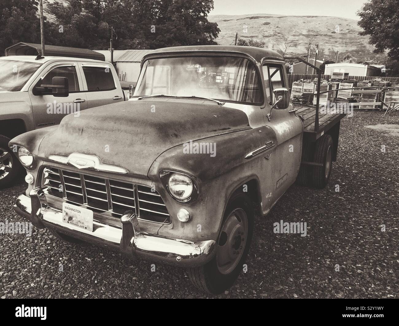 Vintage black and white photo of vintage fifties Chevy work truck 3/4 view - Smartphone Captured Stock Image