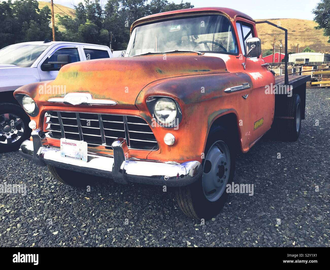 Heavy Chevy- vintage rusted Chevrolet work truck in 3/4 view Stock Photo