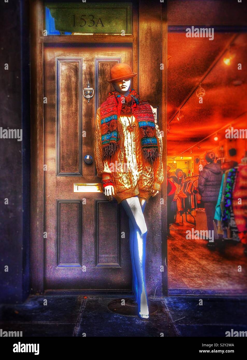 Lady in doorway...a mannequin by the doorway of a clothing shop Stock Photo