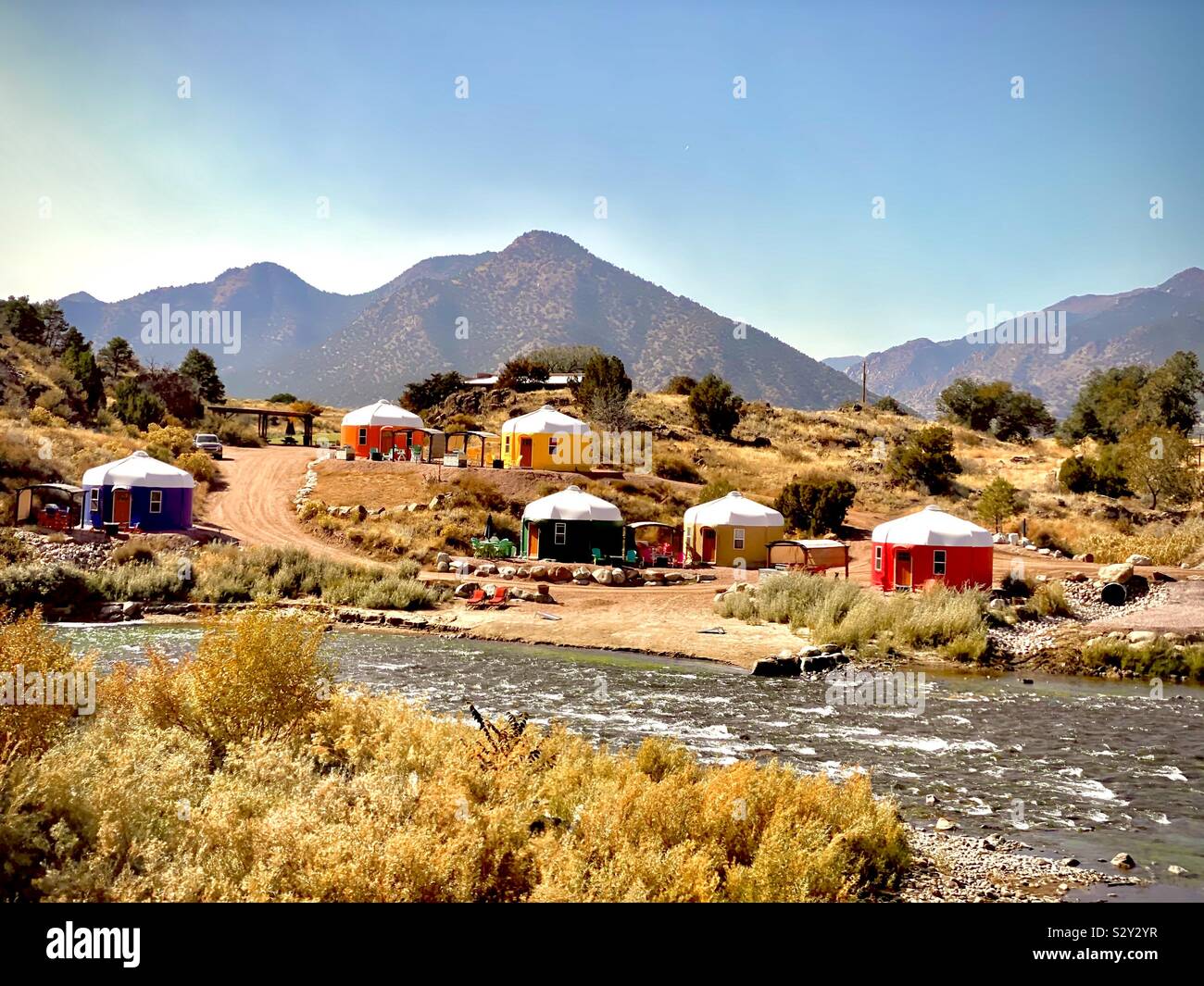 Colorful yurts on the Arkansas River Cañon City Colorado Royal Gorge Rafting Company Stock Photo