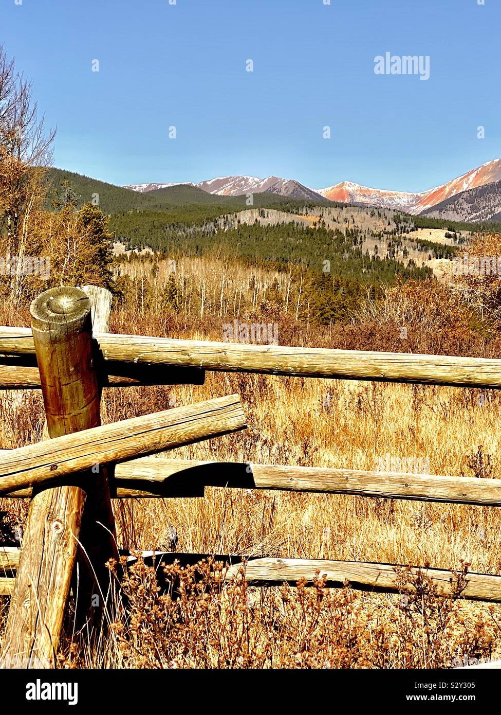 Rail fence and scenic mountains in Colorado Stock Photo