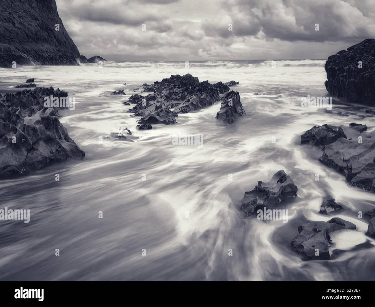 Water rushing through rocks as the tide surge recedes, Mewslade, Gower ...