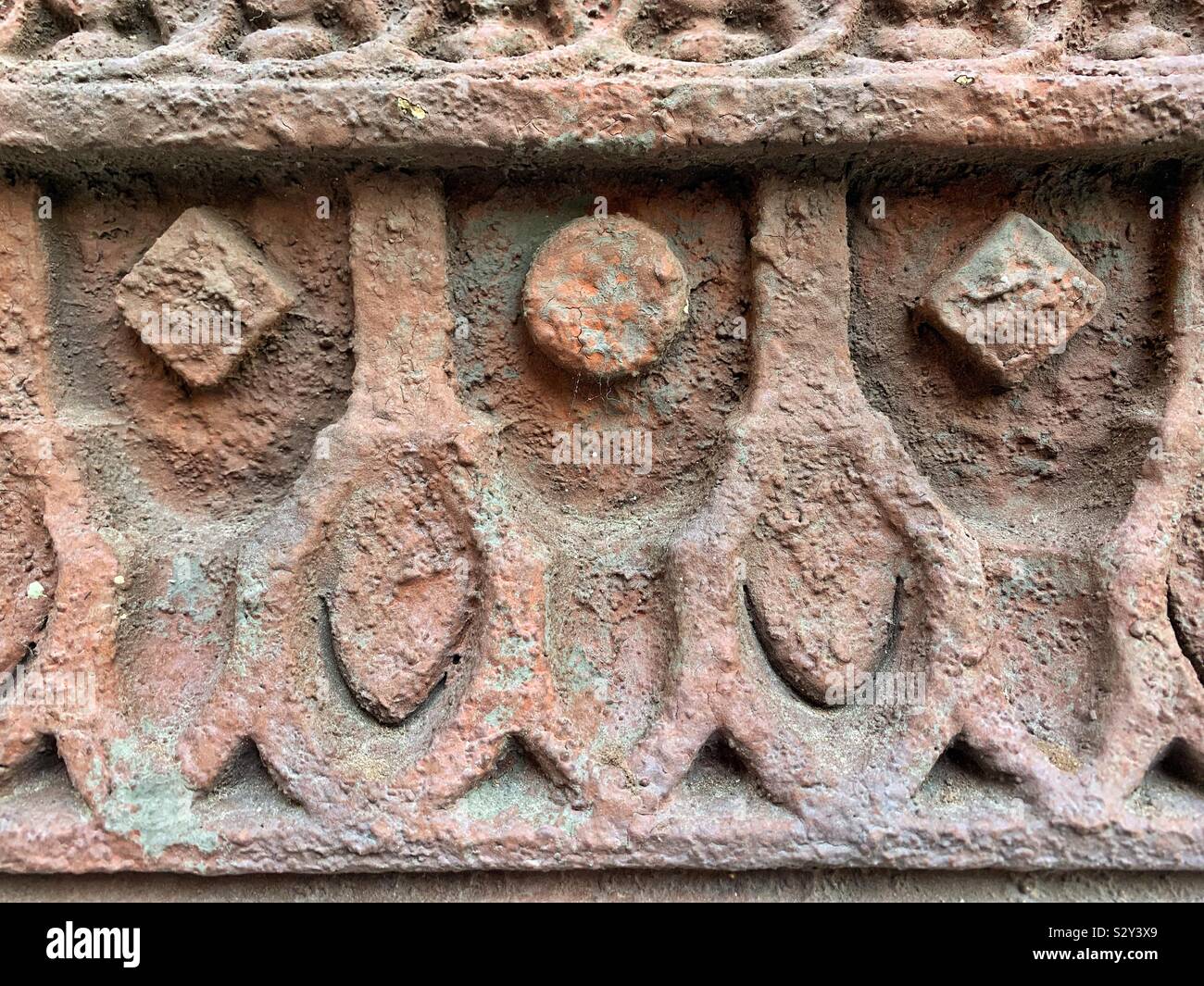 Circles and squares as a beautiful and intricate building facade decoration. - Smartphone Captured Stock Image