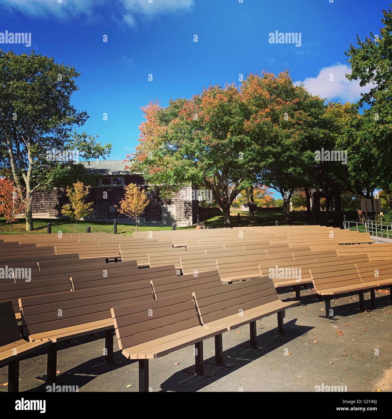 Autumn view of benches at the outdoor amphitheater, Salt Pond Visitor Center, Cape Cod National Seashore, Eastham, Massachusetts, United States. Stock Photo