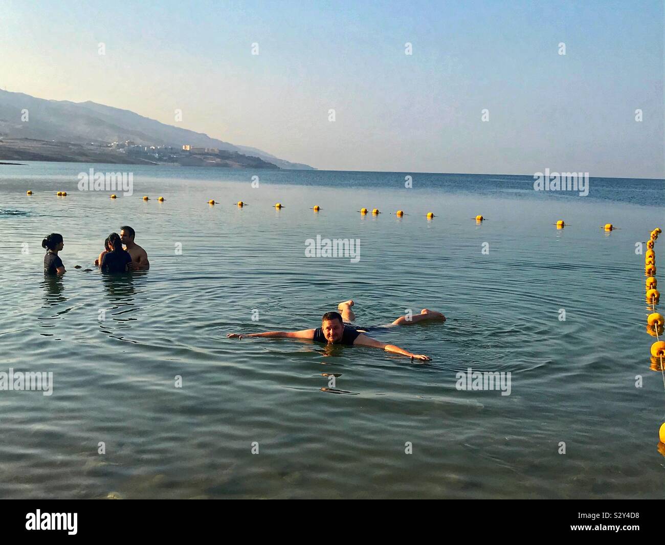 Floating in the Dead Sea. Jordan. Stock Photo